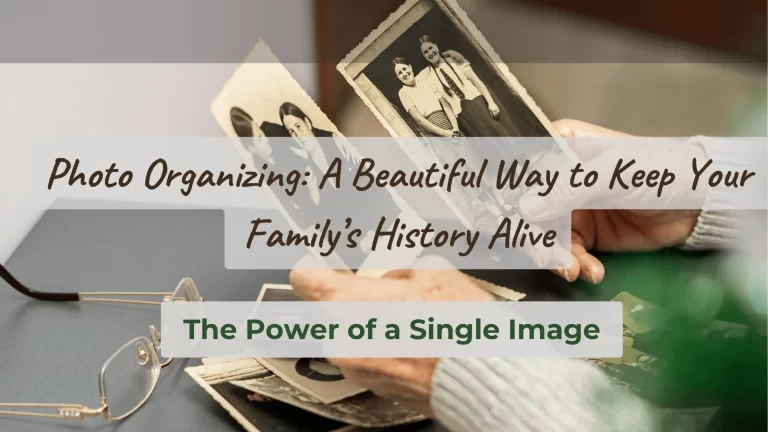 Hands of an older adult holding two vintage photos with more photos on a table beside reading glasses